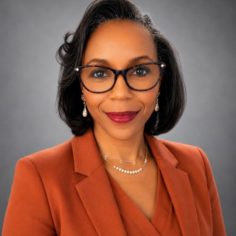Dr. Jeannelle Perkins - Rust Orange Jacket